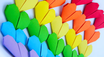 Origami hearts in rainbow colors.