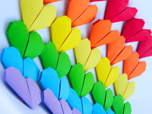 Origami hearts in rainbow colors.